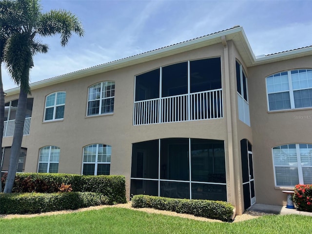 6444 7th Avenue Cir W Unit 6444, Bradenton, FL 34209 - rear view of house with stucco siding and a sunroom
