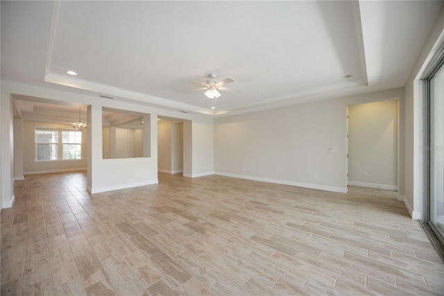 11680 Tapestry Ln, Venice, FL 34292 - spare room with a tray ceiling, a chandelier, ceiling fan, light wood-style flooring, and recessed lighting