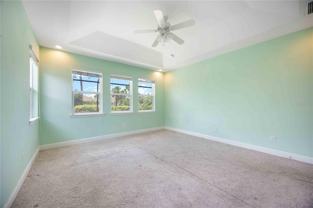 11680 Tapestry Ln, Venice, FL 34292 - empty room with a ceiling fan, carpet floors, a raised ceiling, and recessed lighting