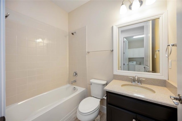11680 Tapestry Ln, Venice, FL 34292 - full bath with independent washer and dryer, vanity, and tub / shower combination