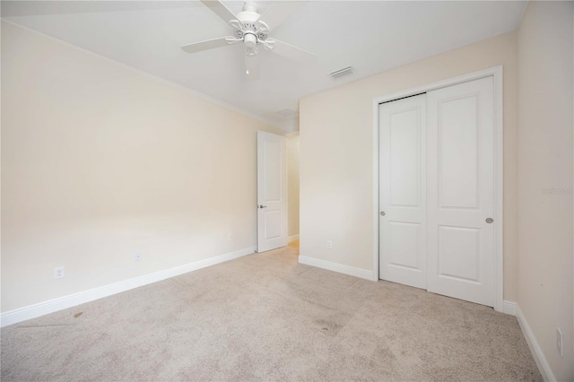 11680 Tapestry Ln, Venice, FL 34292 - unfurnished bedroom featuring carpet flooring, a closet, and ceiling fan