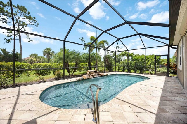 11680 Tapestry Ln, Venice, FL 34292 - outdoor pool featuring a patio and glass enclosure