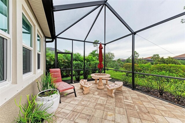 11680 Tapestry Ln, Venice, FL 34292 - view of patio / terrace featuring glass enclosure