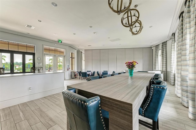 11680 Tapestry Ln, Venice, FL 34292 - dining area featuring wood finish floors, a chandelier, and recessed lighting
