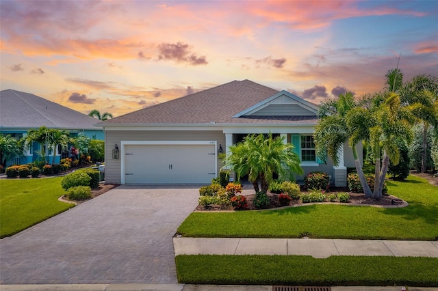 13789 Old Creek Ct, Parrish, FL 34219 - view of front of property with driveway, a garage, a lawn, and a shingled roof