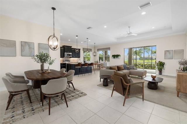 13789 Old Creek Ct, Parrish, FL 34219 - dining area with recessed lighting, a ceiling fan, light tile patterned floors, and a raised ceiling