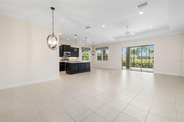 13789 Old Creek Ct, Parrish, FL 34219 - unfurnished living room with a tray ceiling, recessed lighting, a ceiling fan, and light tile patterned flooring