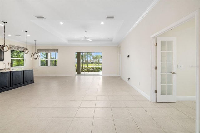 13789 Old Creek Ct, Parrish, FL 34219 - unfurnished living room with a ceiling fan, a tray ceiling, light tile patterned floors, and recessed lighting