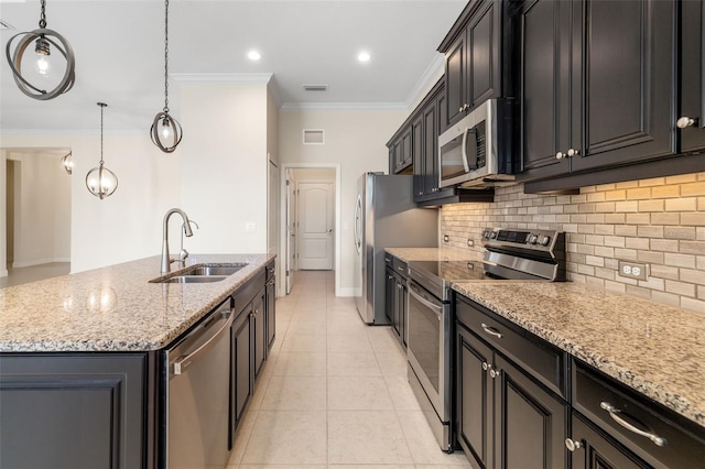 13789 Old Creek Ct, Parrish, FL 34219 - kitchen featuring appliances with stainless steel finishes, ornamental molding, a center island with sink, backsplash, and light stone counters