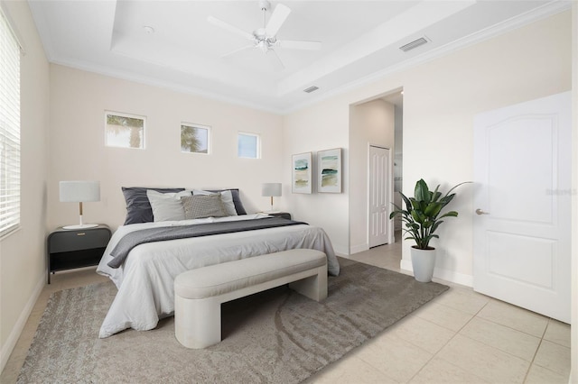 13789 Old Creek Ct, Parrish, FL 34219 - bedroom with a tray ceiling, crown molding, light tile patterned flooring, and a ceiling fan