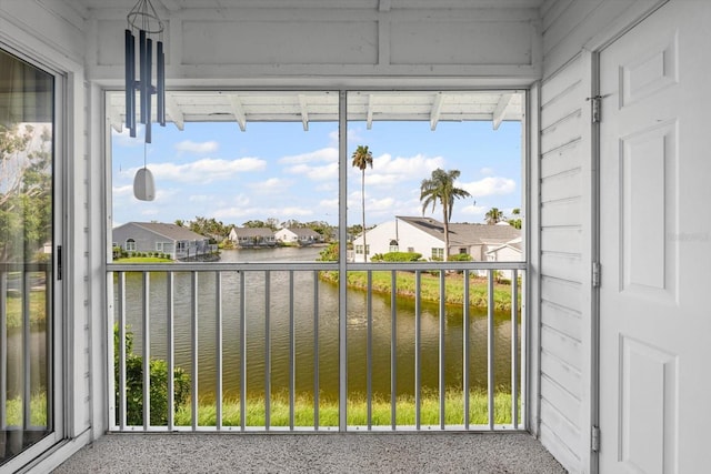 970 Sandpiper Cir Unit 970, Bradenton, FL 34209 - unfurnished sunroom with a water view and a residential view
