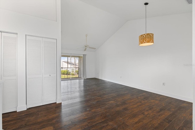 970 Sandpiper Cir Unit 970, Bradenton, FL 34209 - unfurnished living room featuring dark wood-type flooring, high vaulted ceiling, and ceiling fan