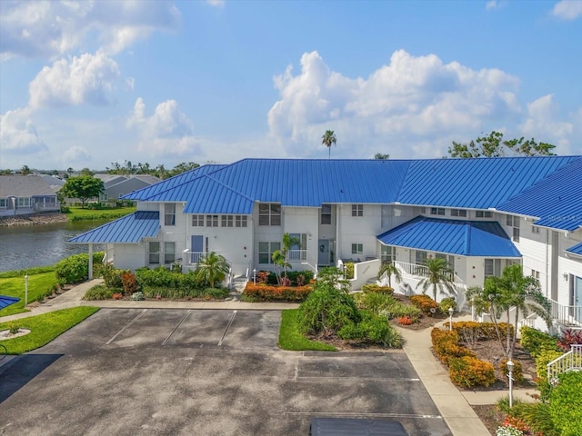 970 Sandpiper Cir Unit 970, Bradenton, FL 34209 - view of property featuring a water view and uncovered parking