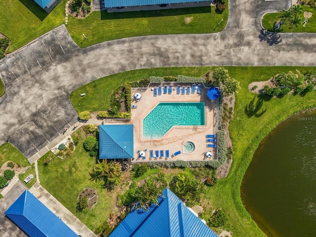 970 Sandpiper Cir Unit 970, Bradenton, FL 34209 - drone / aerial view of a pool area and a nearby body of water