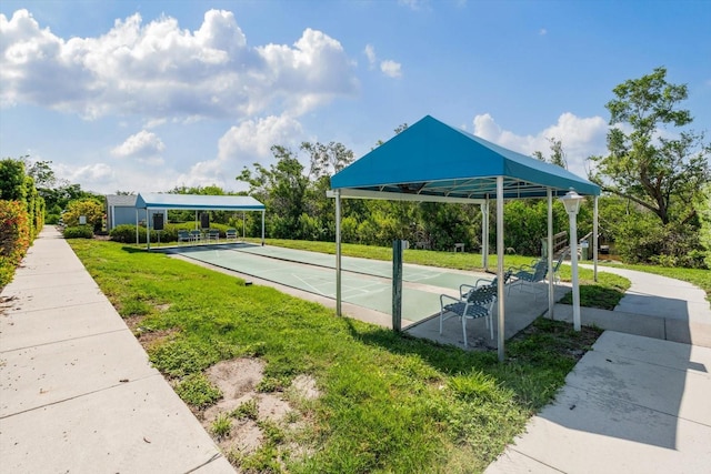970 Sandpiper Cir Unit 970, Bradenton, FL 34209 - view of home's community featuring shuffleboard and a yard