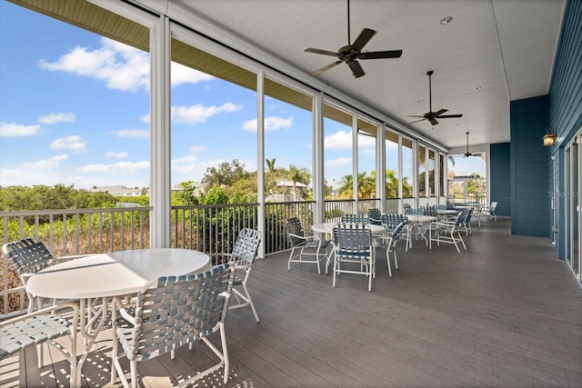 970 Sandpiper Cir Unit 970, Bradenton, FL 34209 - sunroom / solarium with outdoor dining area and a ceiling fan