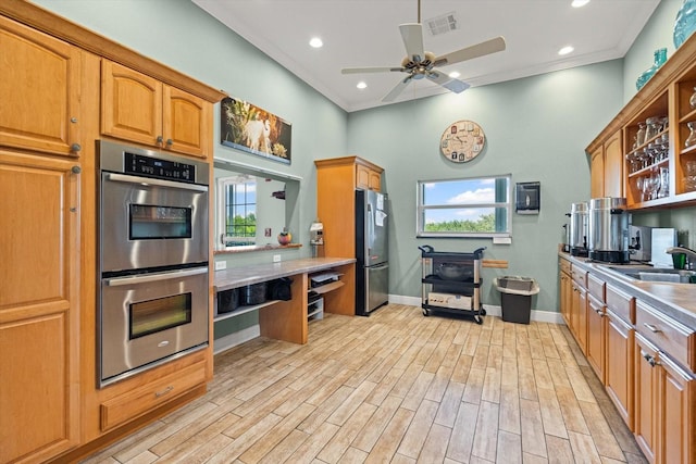 970 Sandpiper Cir Unit 970, Bradenton, FL 34209 - kitchen featuring open shelves, stainless steel appliances, a ceiling fan, a high ceiling, and light wood-style flooring