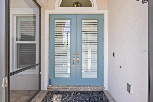 3605 Wild Blossom Pl, Parrish, FL 34219 - property entrance featuring french doors and stucco siding