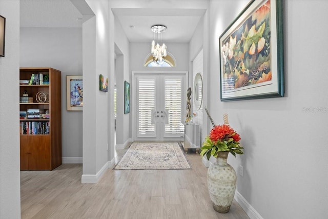 3605 Wild Blossom Pl, Parrish, FL 34219 - foyer entrance with a chandelier and wood finished floors