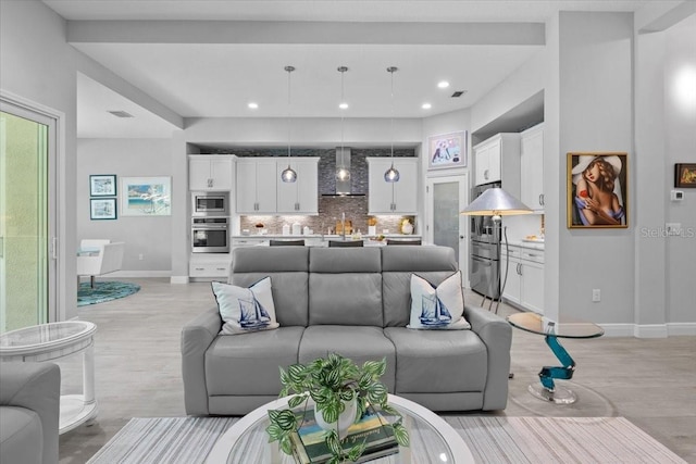 3605 Wild Blossom Pl, Parrish, FL 34219 - living area with light wood finished floors and recessed lighting