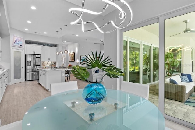 3605 Wild Blossom Pl, Parrish, FL 34219 - dining room with light wood-type flooring and recessed lighting