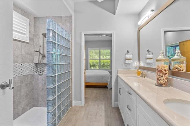 3605 Wild Blossom Pl, Parrish, FL 34219 - full bath with ensuite bath, double vanity, a walk in shower, and wood finished floors