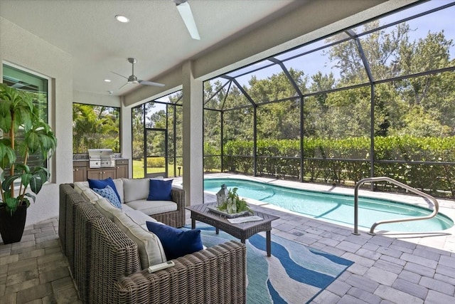 3605 Wild Blossom Pl, Parrish, FL 34219 - swimming pool with area for grilling, an outdoor hangout area, a ceiling fan, a patio, and glass enclosure
