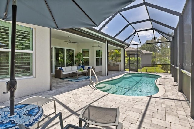 3605 Wild Blossom Pl, Parrish, FL 34219 - swimming pool featuring ceiling fan, an outdoor hangout area, a patio, and glass enclosure