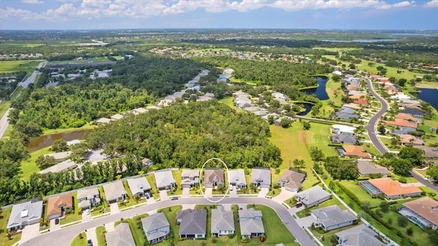 3605 Wild Blossom Pl, Parrish, FL 34219 - aerial overview of property's location featuring a nearby body of water and nearby suburban area