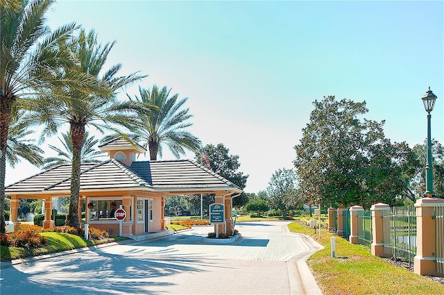 3605 Wild Blossom Pl, Parrish, FL 34219 - view of asphalt street with street lights, curbs, and traffic signs
