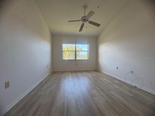 7301 29th Avenue Dr W Unit 310, Bradenton, FL 34209 - spare room with a textured ceiling, wood finished floors, ceiling fan, and lofted ceiling