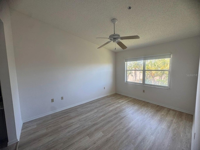 7301 29th Avenue Dr W Unit 310, Bradenton, FL 34209 - unfurnished room with a textured ceiling, ceiling fan, and wood finished floors