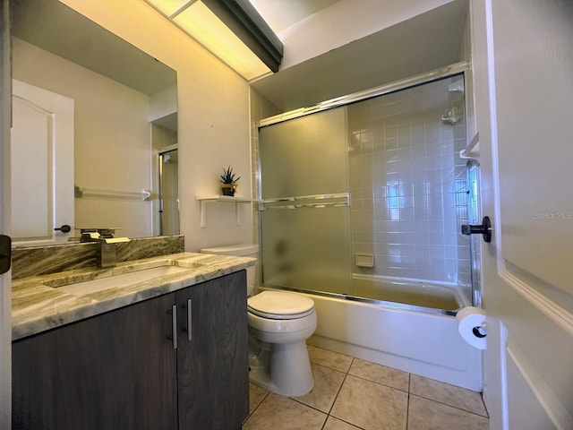 7301 29th Avenue Dr W Unit 310, Bradenton, FL 34209 - bathroom featuring vanity, tile patterned floors, and shower / bath combination with glass door