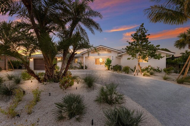 615 Concord Ln, Holmes Beach, FL 34217 - single story home with stucco siding and a garage