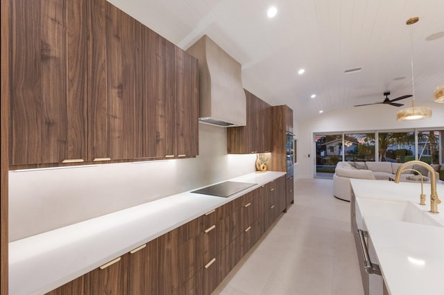 615 Concord Ln, Holmes Beach, FL 34217 - kitchen featuring modern cabinets, black electric stovetop, recessed lighting, light countertops, and vaulted ceiling