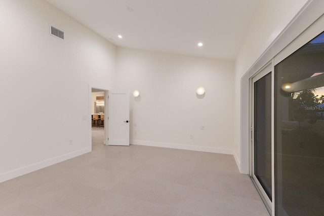 615 Concord Ln, Holmes Beach, FL 34217 - spare room with recessed lighting and high vaulted ceiling