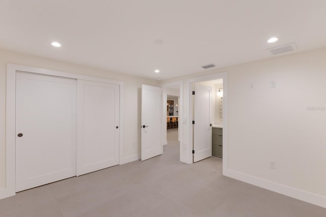 615 Concord Ln, Holmes Beach, FL 34217 - unfurnished bedroom with recessed lighting and a closet