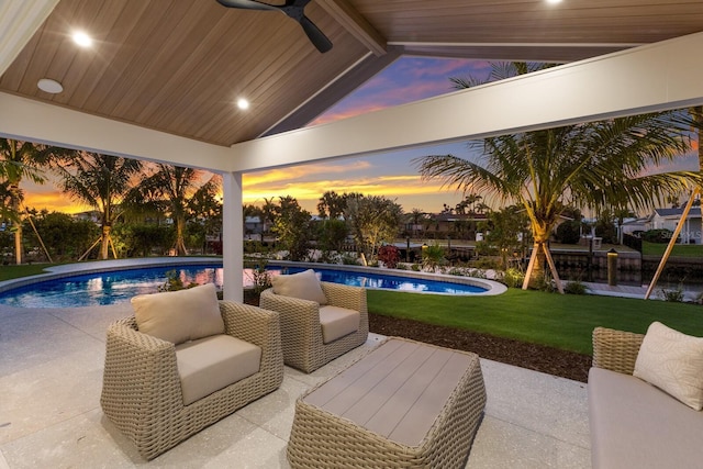 615 Concord Ln, Holmes Beach, FL 34217 - outdoor pool with ceiling fan, a lawn, and a patio area