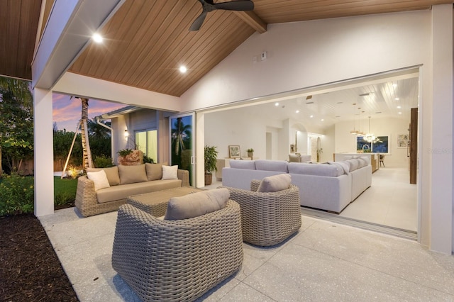 615 Concord Ln, Holmes Beach, FL 34217 - patio terrace at dusk featuring an outdoor hangout area, a patio, and ceiling fan
