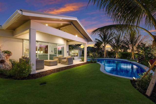 615 Concord Ln, Holmes Beach, FL 34217 - outdoor pool with outdoor lounge area, a lawn, and a patio