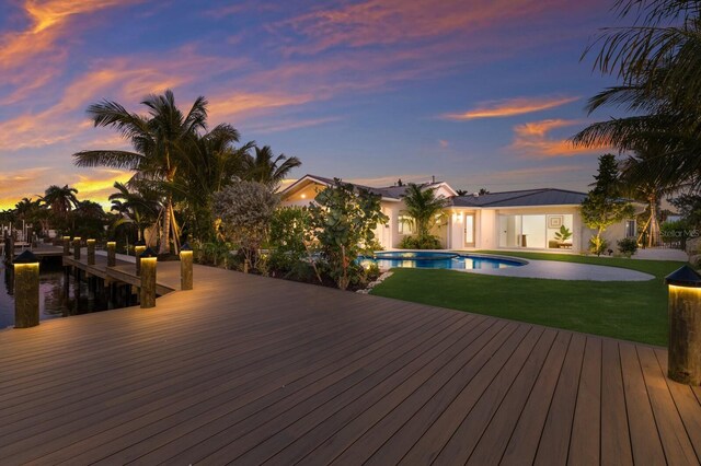 615 Concord Ln, Holmes Beach, FL 34217 - swimming pool with a yard and a dock