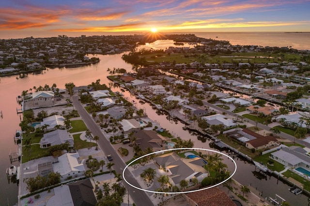 615 Concord Ln, Holmes Beach, FL 34217 - aerial view of property and surrounding area featuring a nearby body of water and nearby suburban area