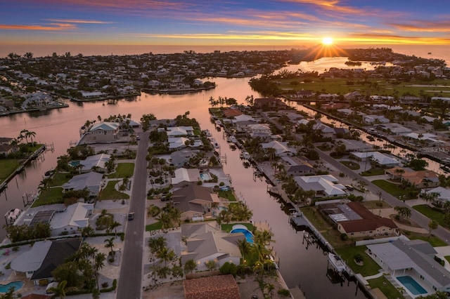 615 Concord Ln, Holmes Beach, FL 34217 - aerial overview of property's location featuring a large body of water and nearby suburban area