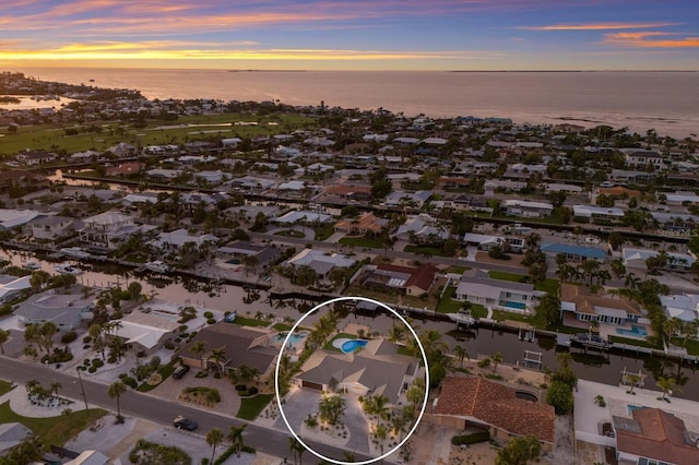 615 Concord Ln, Holmes Beach, FL 34217 - aerial view of property's location with a nearby body of water and nearby suburban area