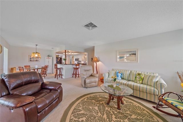 7216 11th Ave W Unit 203, Bradenton, FL 34209 - living area with carpet flooring and a textured ceiling
