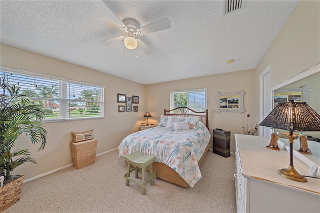 7216 11th Ave W Unit 203, Bradenton, FL 34209 - bedroom featuring a textured ceiling, light carpet, and ceiling fan