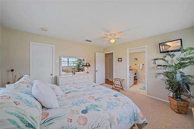 7216 11th Ave W Unit 203, Bradenton, FL 34209 - bedroom featuring light colored carpet, a ceiling fan, and ensuite bath