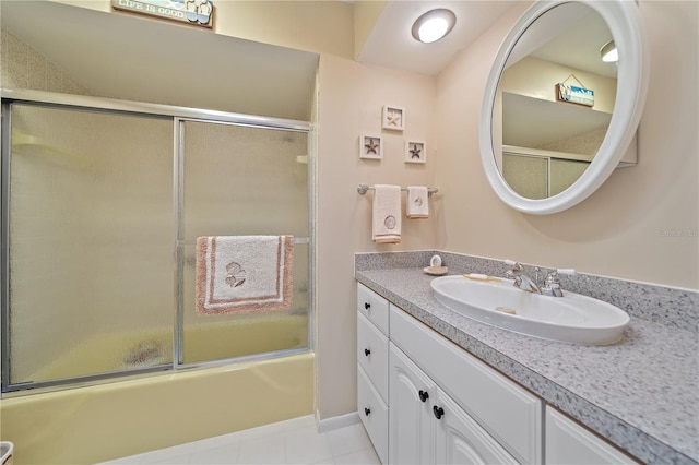 7216 11th Ave W Unit 203, Bradenton, FL 34209 - bathroom with vanity and bath / shower combo with glass door