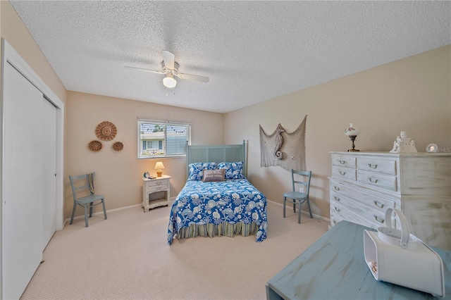 7216 11th Ave W Unit 203, Bradenton, FL 34209 - carpeted bedroom with a closet, a ceiling fan, and a textured ceiling
