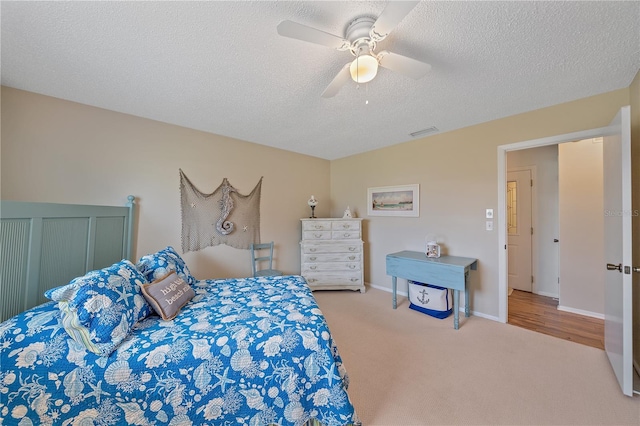 7216 11th Ave W Unit 203, Bradenton, FL 34209 - bedroom with carpet floors, a textured ceiling, and ceiling fan